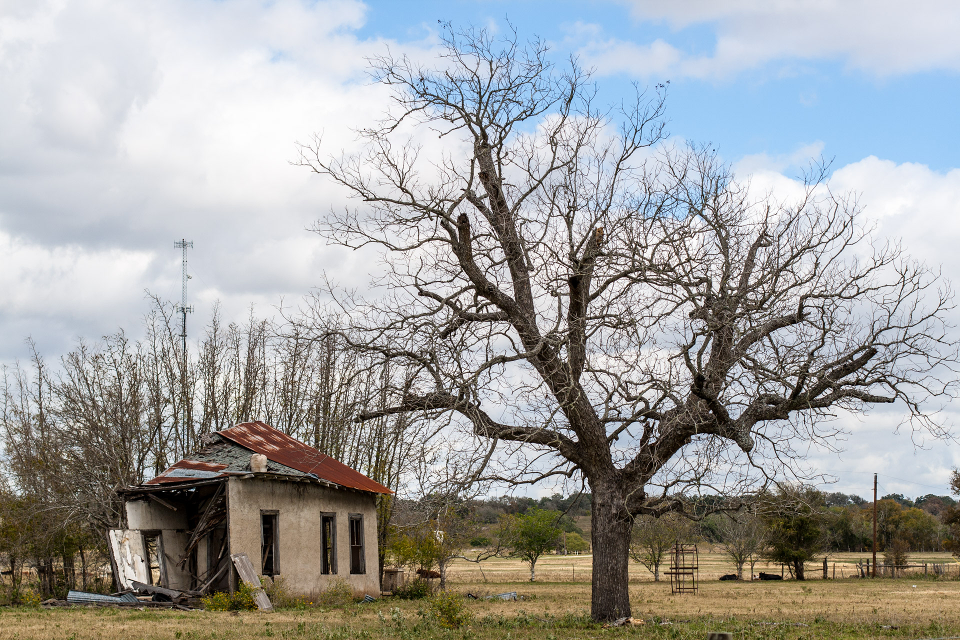 La Grange, Texas - An Impacted Roof Farmhouse (left far)