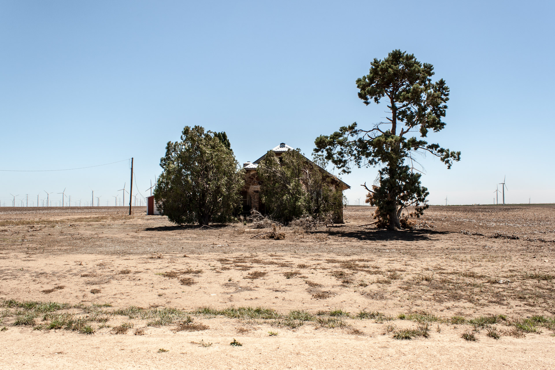 Wind Turbine Community Stone House (front far)